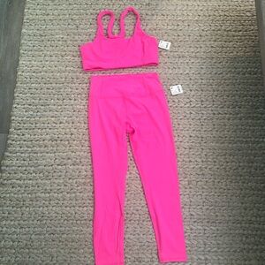 NWT- free people movement set. In pink both size M